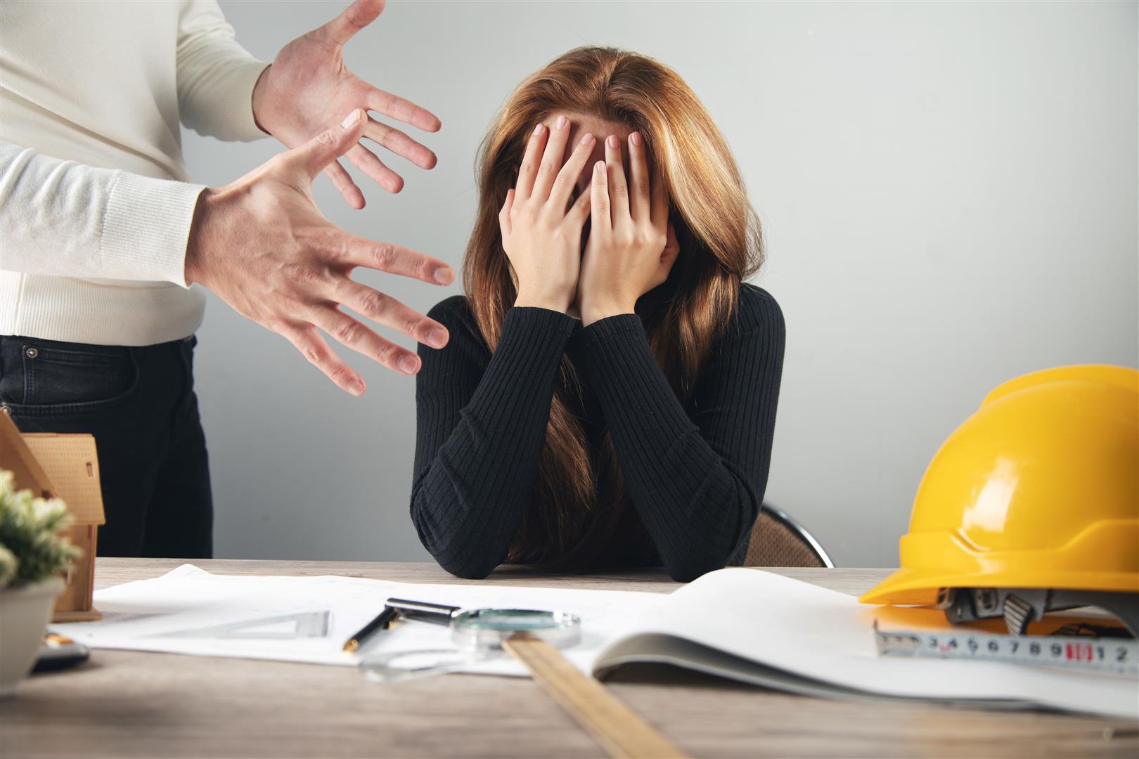 angry-businessman-with-sad-woman-office.jpg